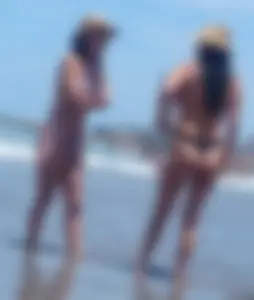 2 milfs in thong bikinis on the beach