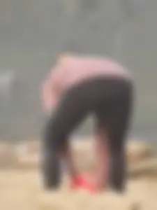 Beach volleyball blonde lady in tight leggings
