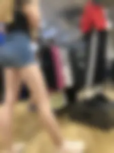 Girl with Amazing Hot Legs in Denim Shorts in a Store Candid