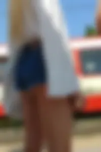 Sexy blonde showing her ass cheeks in short denim shorts and slightly see through shirt