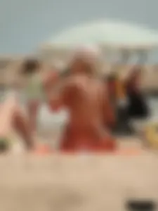 Tattooed blonde with big tits topless and in thong