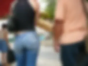 Red haired lady with a nice ass in tight jeans waiting for the bus
