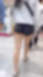 Asian girl in tight black shorts at the mall