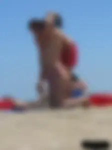 Purple thong topless lady on the beach gets oiled up by her husband