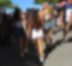 Three sexy friends in denim shorts and a skirt