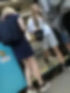 Very cute teen candid girl in a dress sitting on a bus stop creepshots