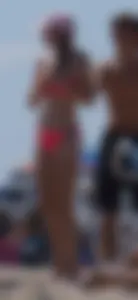 Sexy and skinny girl on the beach in pink bikini