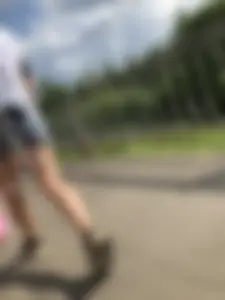 Cute Girl in Denim Shorts Walking Down a Railway Station Gallery