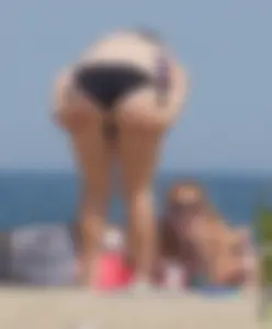 3 girls on the beach in bikinis with big boobs, one brunette and two blondes