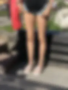 Girl in Denim Shorts with Amazing Hot Legs Fixing Her Sandals Street Candid Photo Gallery