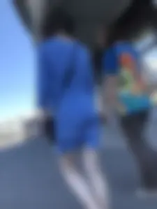 Girl in a Blue Dress With Pale Legs Walking Down the Street - Strong Wind Making Her Panty Line Visible