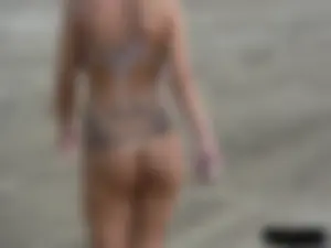 Tattooed blonde with big tits topless and in thong