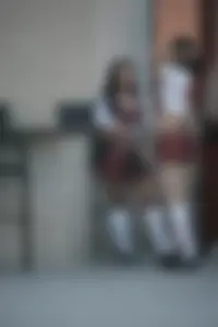 Two sexy Tilted Kilt employees showing cleavage and cheeks