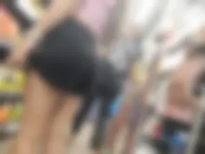 Nerdy girl in shorts looking for snaks