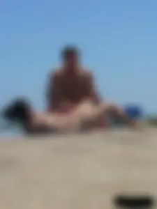 Purple thong topless lady on the beach gets oiled up by her husband