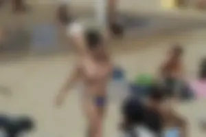 Topless girls on a beach in Barcelona