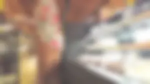 Blond milf shopping for groceries shows a hint of cheeks