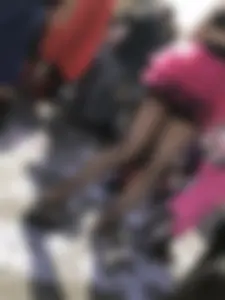 Hot carnival girl in in a top, mini shorts with pink frill and awesome legs in fishnet pantyhose
