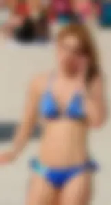 Sexy ass redhead with a great body in blue semi thong bikini