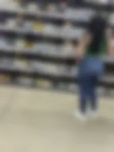 Sexy Latina buying wine
