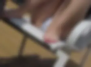 Milf in Shorts Sitting in a Chair Feet And Crotch Closeup