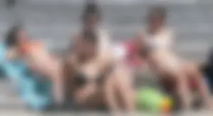 Bunch of sexy babes at the beach in bikinis
