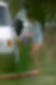 Girl getting out of her swimsuit and changing her panties while flashing pubes