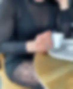 Sexy legs in patterned black pantyhose closeups