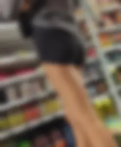 Skinny babe in booty shorts looking for groceries