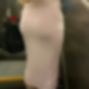 Blonde college girl with a baby face in a very tight dress