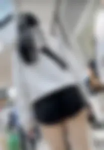 Asian girl in tight black shorts at the mall