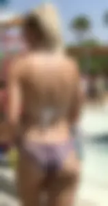 Two sexy blondes at a water park with nice asses in bikinis