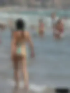 Bunch of sexy babes at the beach in thong bikinis