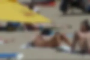 Girls on a nude beach in Sitges, Spain