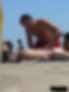 Purple thong topless lady on the beach gets oiled up by her husband