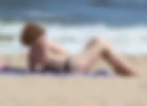 Two sexy beach teens in bikinis, one thick and one skinny with big boobs
