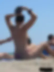Purple thong topless lady on the beach gets oiled up by her husband