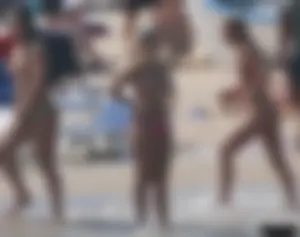 A bunch of sexy beach voyeur babes in bikinis, thongs and topless