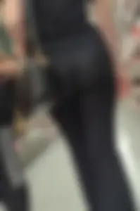 Brunette babe in black flares