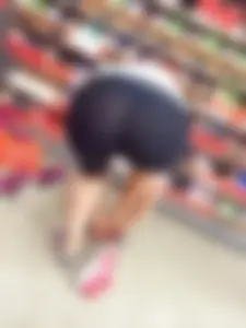Candid Girl With Hot Firm Ass Bending Over While Trying On Sneakers at the Store Creepshot