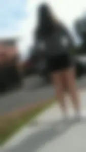 Girl in shorts on the suburban street