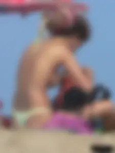 Sexy girls going topless at the beach showing off their sexy bodies