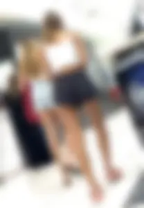 Cheeky short shorts blonde going up escalator