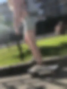 Girl in Denim Shorts on Skateboard Street Candid Photos
