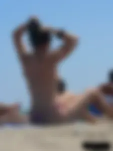 Purple thong topless lady on the beach gets oiled up by her husband