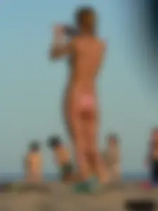 Bunch of sexy babes on the beach topless and in thong bikinis