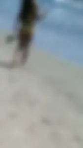 Beach babe with a nice ass and big tits in yellow thong bikini