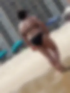 Thick beach girl in black bikini with big ass and tits