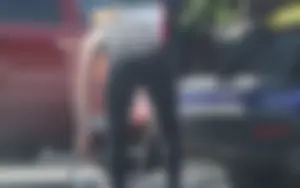 Redhead milf with a nice ass and vtl in leggings while loading her car
