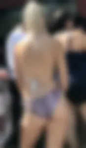 Two sexy blondes at a water park with nice asses in bikinis